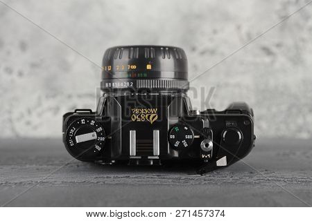 Moscow, Russia, November 29, 2018. The Old Soviet 35 Mm Slr Camera Zenit 122, Released 1997, On A Gr