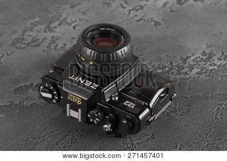 Moscow, Russia, November 29, 2018. The Old Soviet 35 Mm Slr Camera Zenit 122, Released 1997, On A Gr