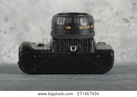 Moscow, Russia, November 29, 2018. The Old Soviet 35 Mm Slr Camera Zenit 122, Released 1997, On A Gr