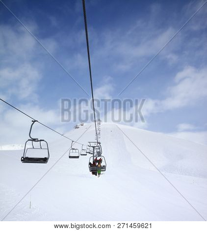 Chair-lift, Snow Ski Slope And Cloudy Sky With Falling Snow. Caucasus Mountains At Winter, Georgia, 