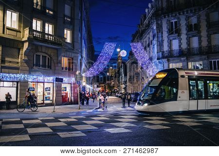 Strasbourg, France - Nov 29, 2017: Beautiful Christmas City Scene With Garland Over The Large Street