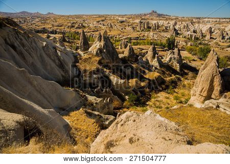 Cappadocia, Turkey: Beautiful Landscape On The Panorama Of Mountains And Rocks. The Fortress Of Uchi