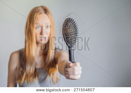 Hair Loss In Women Concept. A Lot Of Lost Hair On The Comb