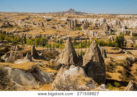 Cappadocia, Turkey: Beautiful Landscape On The Panorama Of Mountains And Rocks. The Fortress Of Uchi