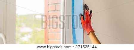 Man In A Blue Shirt Does Window Installation Banner, Long Format