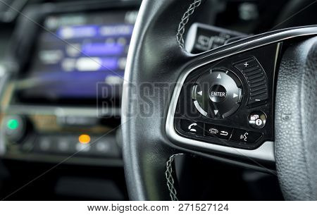 Transportation Vehicle And Car Cruise Control Concept - Close Up Car Cruise Control On Car Steering 