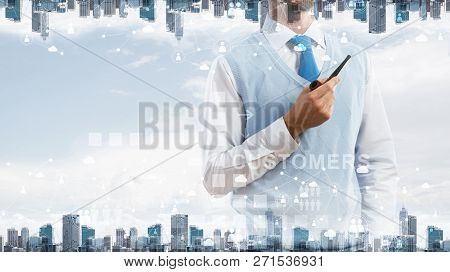 Double Exposure Of Confident And Young Businessman In Smart-casual Wear Smoking Pipe And Modern City