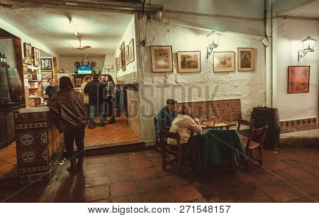Cordoba, Spaine - Nov 18: People Drinking And Eating At Traditional Tapas Bar Or Restaurant With Win