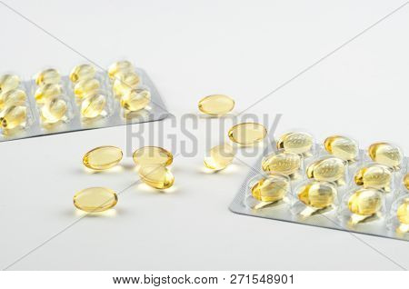 Fish Oil Omega3 Capsules And Blister Biologically Active Additive On A Light Background Close-up Sid