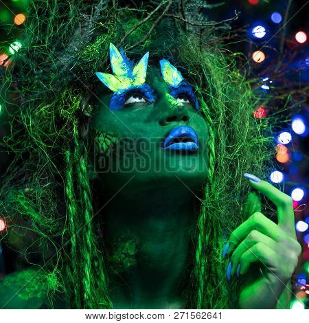 Mystic Green Dryad In Uv Fluor Black Light With Glowing Trees On Background