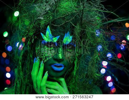 Mystic Green Dryad In Uv Fluor Black Light With Glowing Trees On Background
