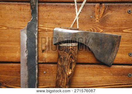 Vintage Ax Narrow Blade Vertical Wooden Panel Close-up On Wooden Background.