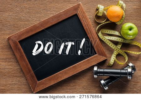 Fruits, Dumbbells, Measuring Tape And Wooden Chalk Board With Do It Quote, Dieting And Healthy Lifes