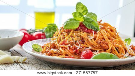 Fresh And Delicious Spagetti Bolognese On Wooden Table.