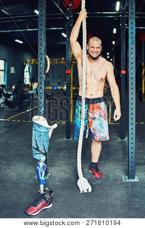 Sportsman With Prosthesis Working Out In Gym
