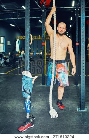 Sportsman With Prosthesis Working Out In Gym