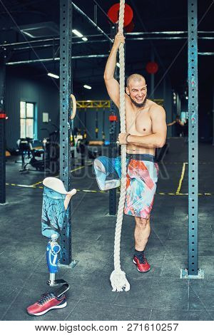 Sportsman With Prosthesis Working Out In Gym