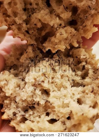 A Halved, Ripped Banana Muffin Viewed From The Inside