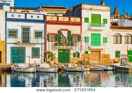 View Of Porto Colom Harbour With Colorful Houses On Majorca, Spain Balearic Islands