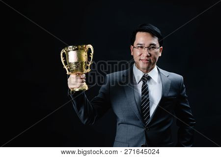Asian Man In Formal Suit Holding And Rise Golden Trophy Cup, Reward Of Target Achievement Winner, Pr