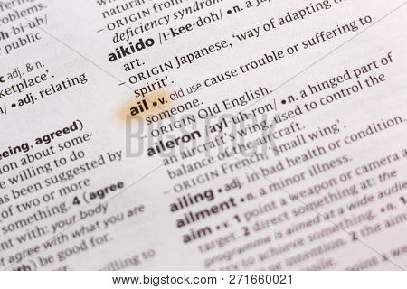 The Word Or Phrase Ail In A Dictionary Highlighted With Marker.