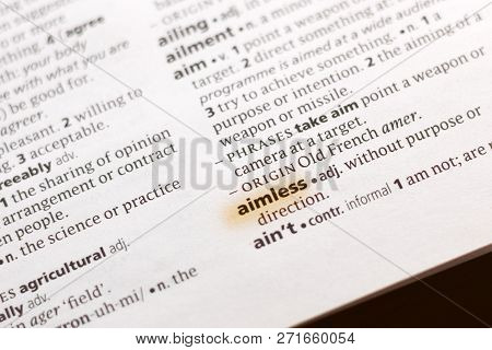 The Word Or Phrase Aimless In A Dictionary Highlighted With Marker.