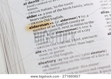 The Word Or Phrase Alderman In A Dictionary Highlighted With Marker.