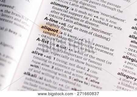 The Word Or Phrase Aliquot In A Dictionary Highlighted With Marker.