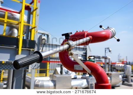 Fireplug To Put Out A Fire Against The Background Of An Installation At An Oil Refinery