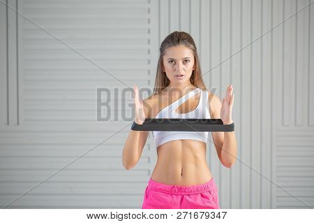 Fitness Young Woman Doing Back Exercise With Resistance Band For Training Strength. Female Athete Ex