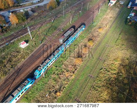 Koszalin, Poland - 13 September 2018 - Aerial view on main rail traction in Koszalin City with blue electric locomotive.