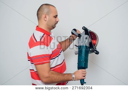 Construction Worker With A Puncher Scream On A White Background.