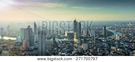 Skyscraper On Cityscape At Chaopraya River In Bangkok Metropolis Thailand On Sunset Time