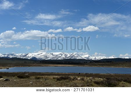 Snowy Mountains At Lake Cheybekköl, In The Ulagansky Region Of The Mountainous Altai