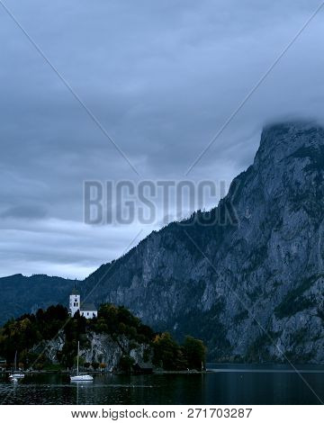 Beautiful Scenic Sunset Over Austrian Alps Lake. Boats, Yachts In The Sunlight Infront Of Church On 
