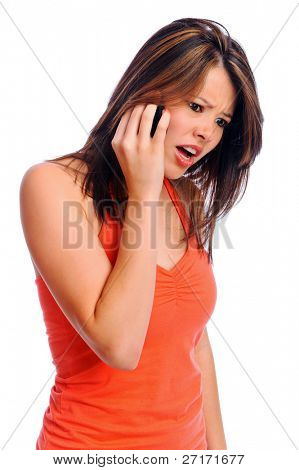Unhappy girl using her cell phone isolated on white in studio