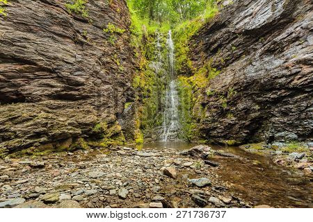 Little Waterfall In Green Summer Mountains, Norway.