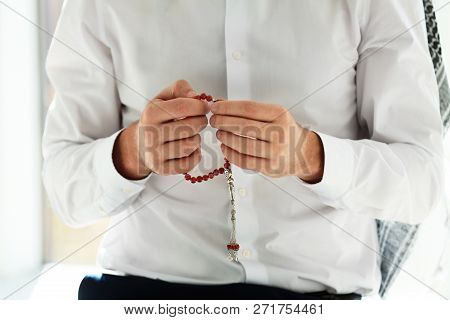 Muslim Man With Misbaha Praying Indoors, Closeup