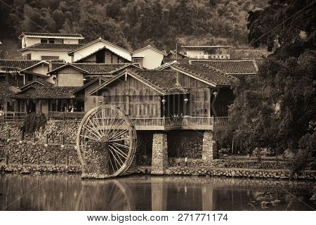 FUJIAN, CHINA â MARCH 2, 2018: Yunshuiyao old town by the river with watermill in Fujian, China.