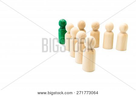 Green Figure Leading Group Of Wooden Figures In Spearhead Formation