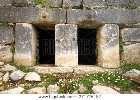 Ruined Walls Of Castle Over The Lake Bafa In A Nature Reserve Situated In Southwestern Turkey