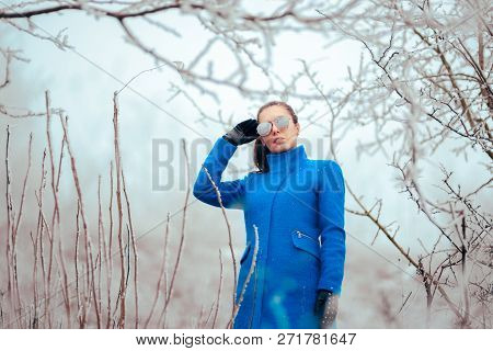 Fashion Winter Woman With Mirror Sunglasses And Blue Coat