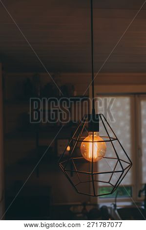 Edison Lamp In Vintage Style Lighting In Evening Home Interior. Earth Hour And Enegry Save Concept.