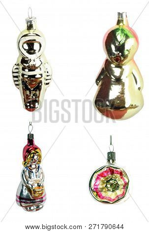 Four Christmas Fir Tree Toys Isolated At Dry Sunny Day