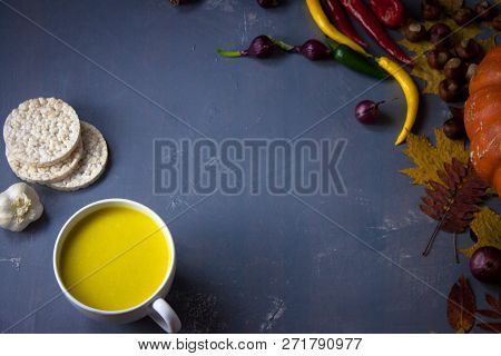 Pumpkin Asian Coconat Cream Soup. Autumn Hot Food. Chili Pepper, Garlic, Red Onion, Big Pumpkin. Dar