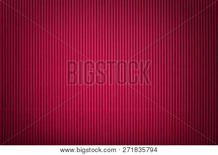 Texture Of Corrugated Dark Red Paper With Vignette, Macro. Striped Pattern Of Maroon Cardboard Backg