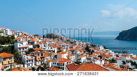 Summer Day Panoramic View From Hill On Old Skopelos Town With Traditional Greek White Walls Building