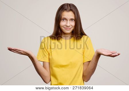 A Young Girl Smiles And Raises Her Hands. She Said, Oops, I Didnt Do It. He Shrugs In Confusion. Sud