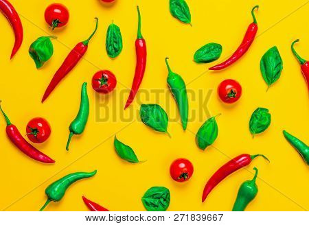 Above View At Chili Pepper And Tomatoes With Basil On Yellow Background