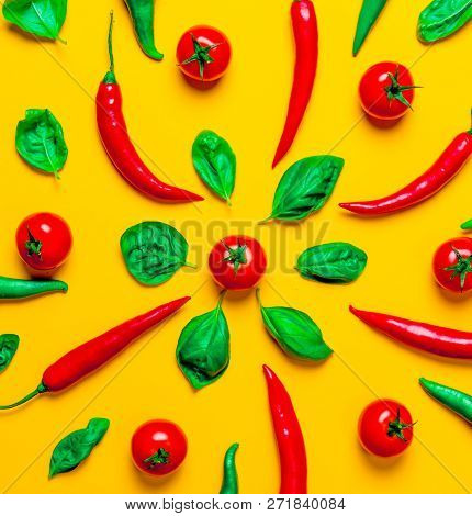 Above View At Chili Pepper And Tomatoes With Basil On Yellow Background